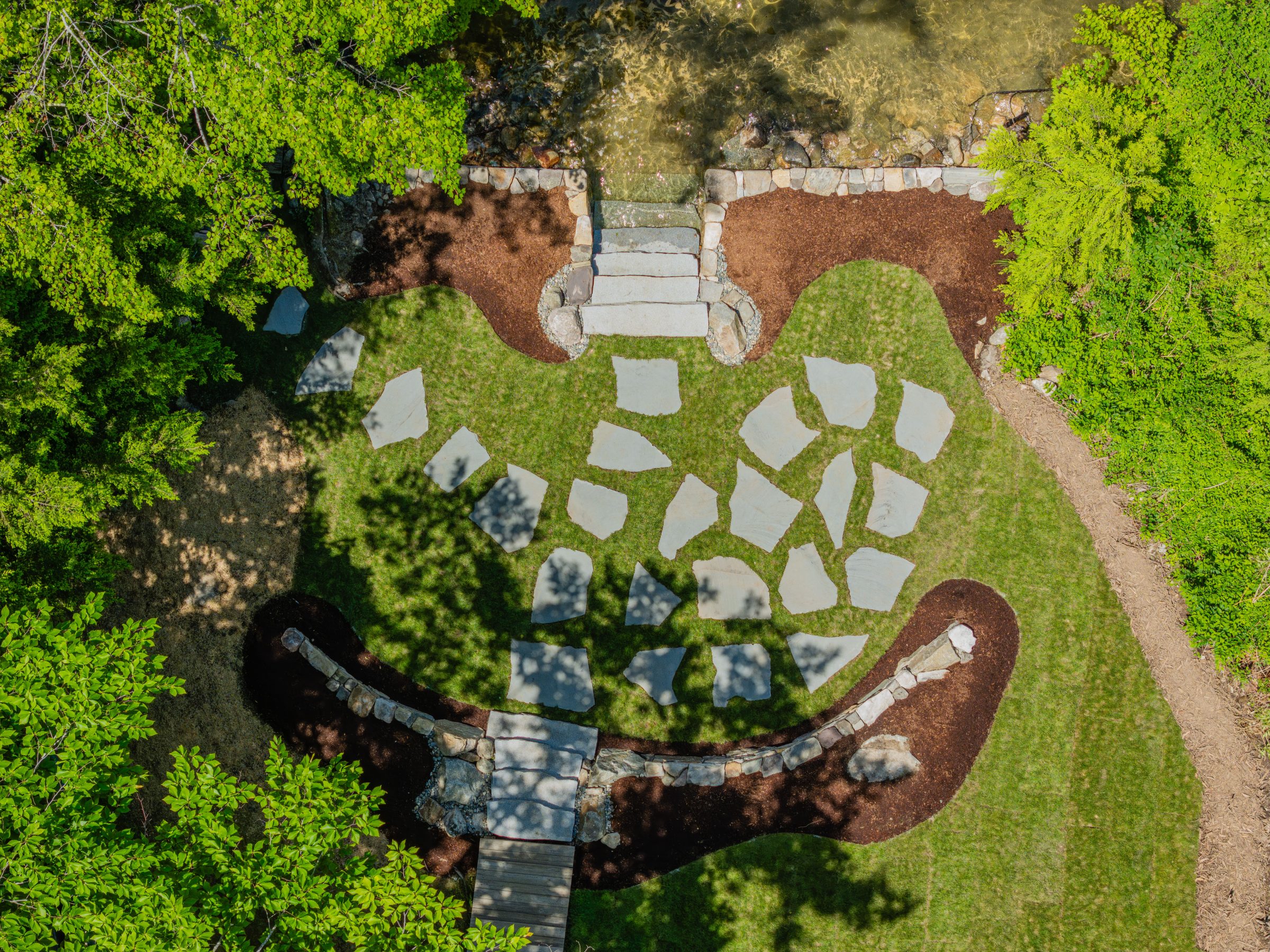 Aerial view of landscaped garden with stone pathways