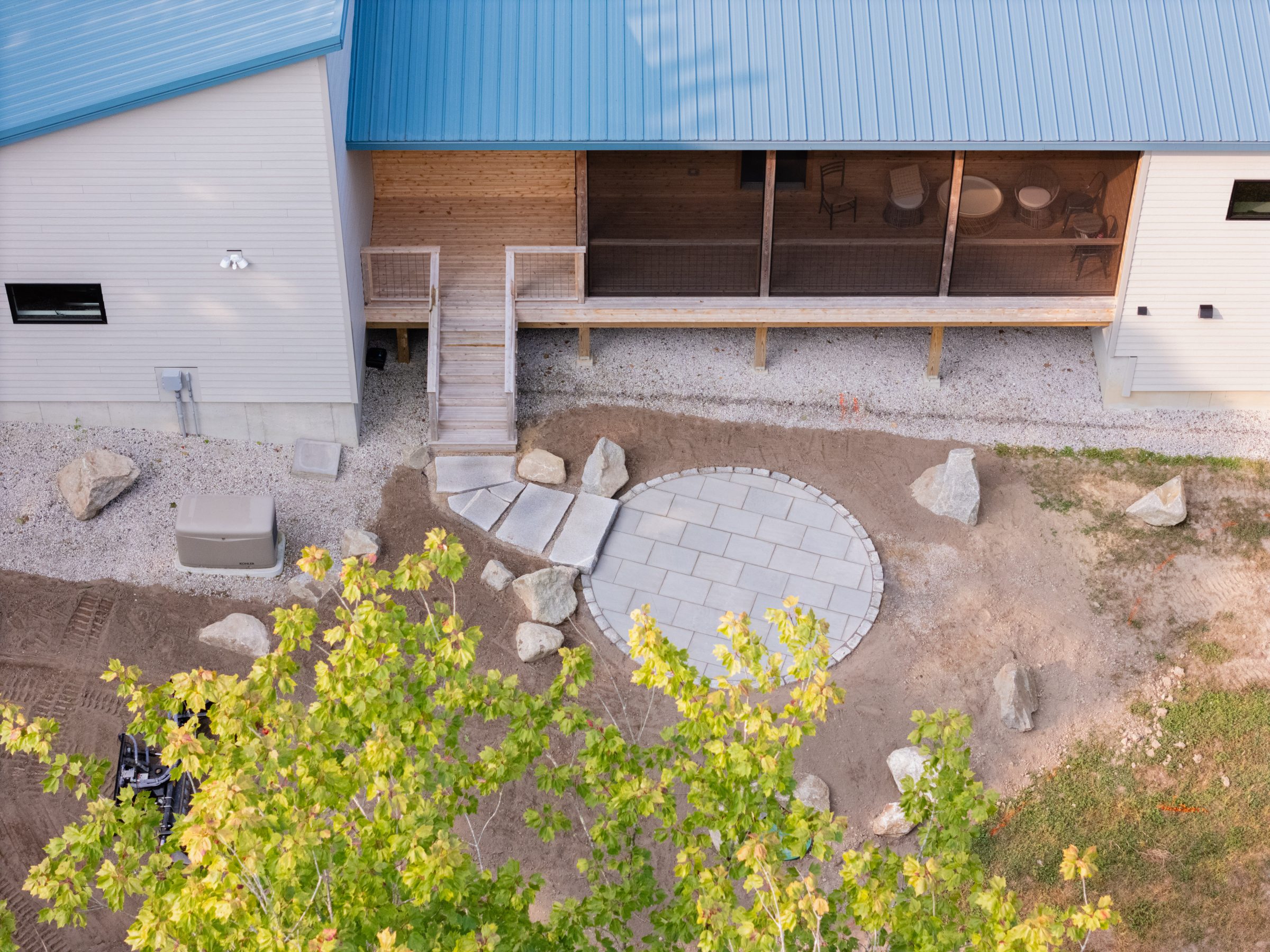 Aerial view of backyard patio and wooden deck