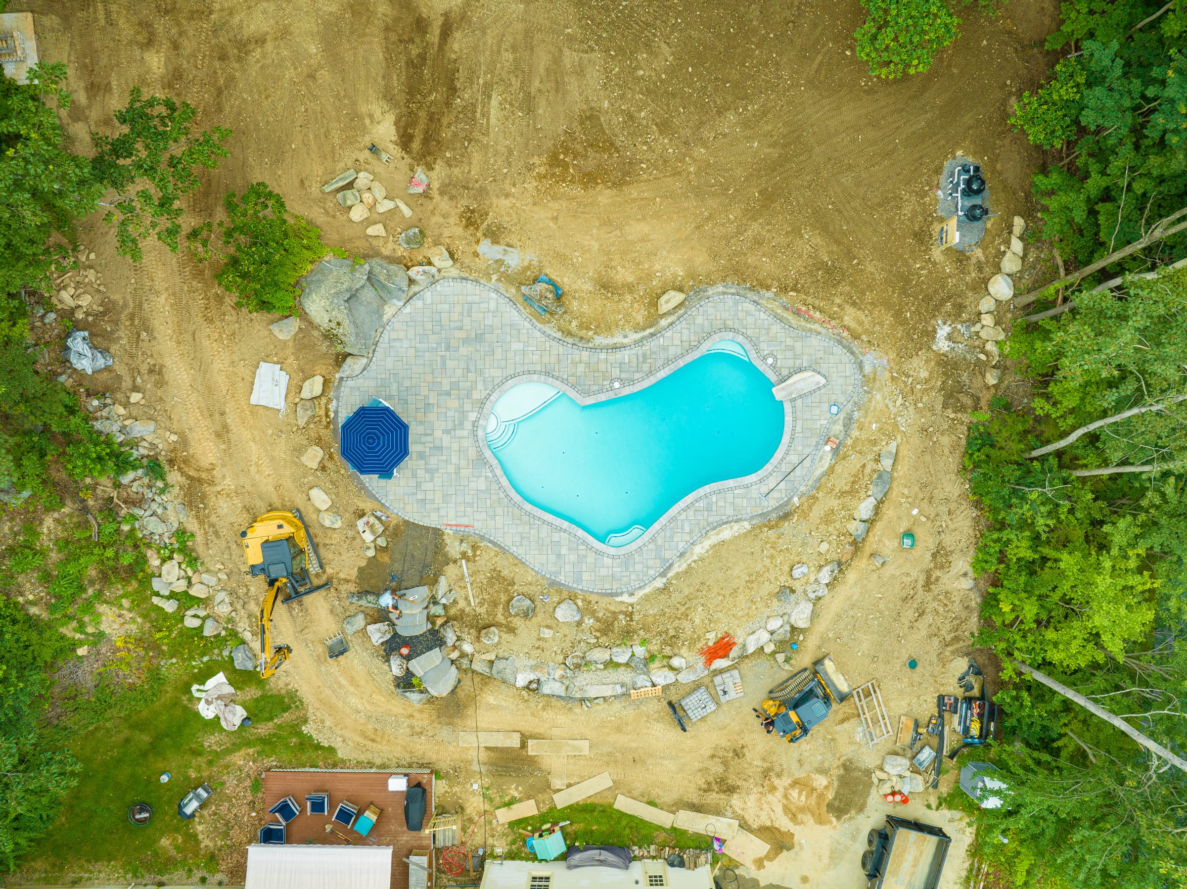 Aerial view of backyard pool under construction