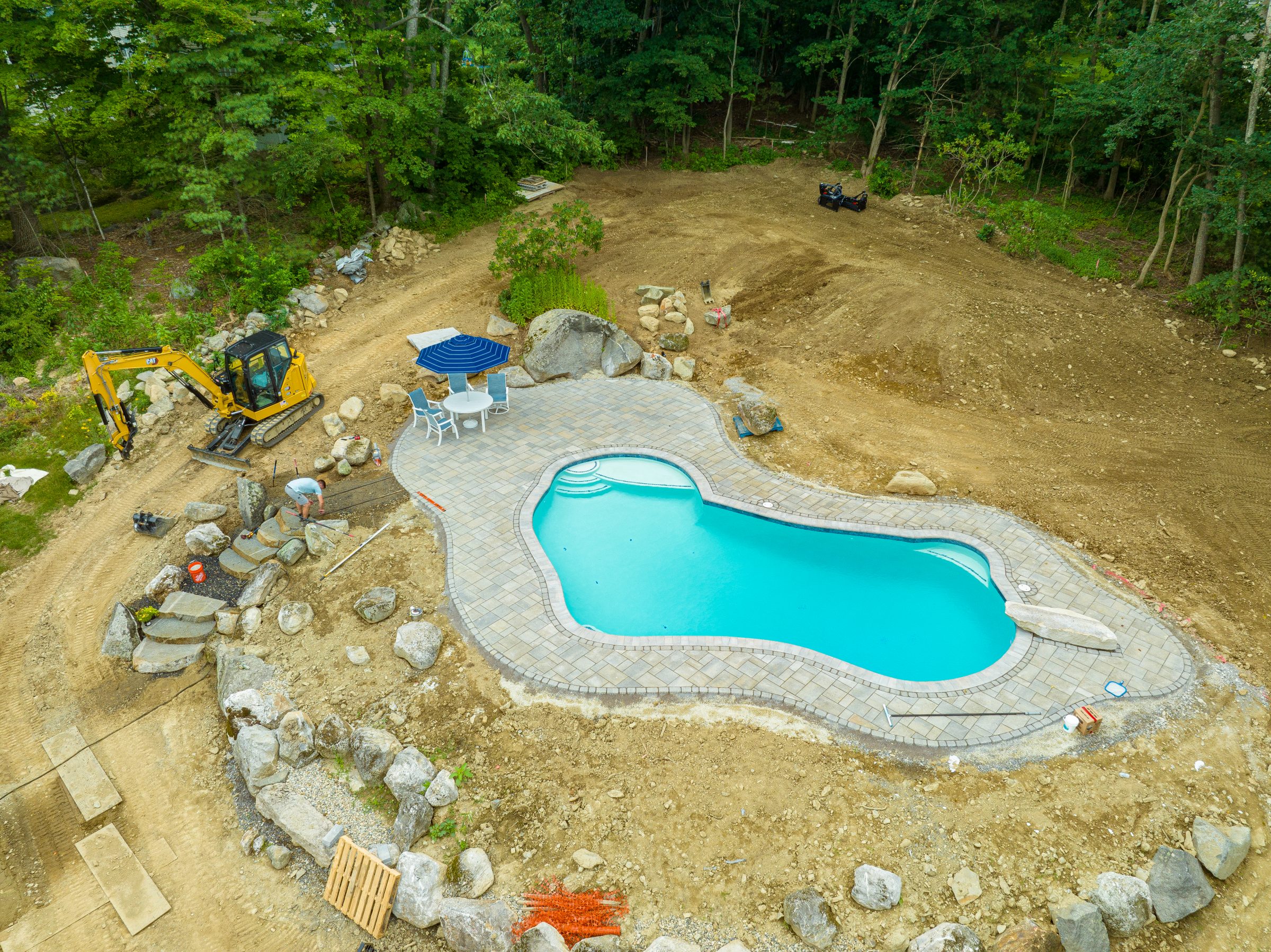 Aerial view of backyard pool construction site