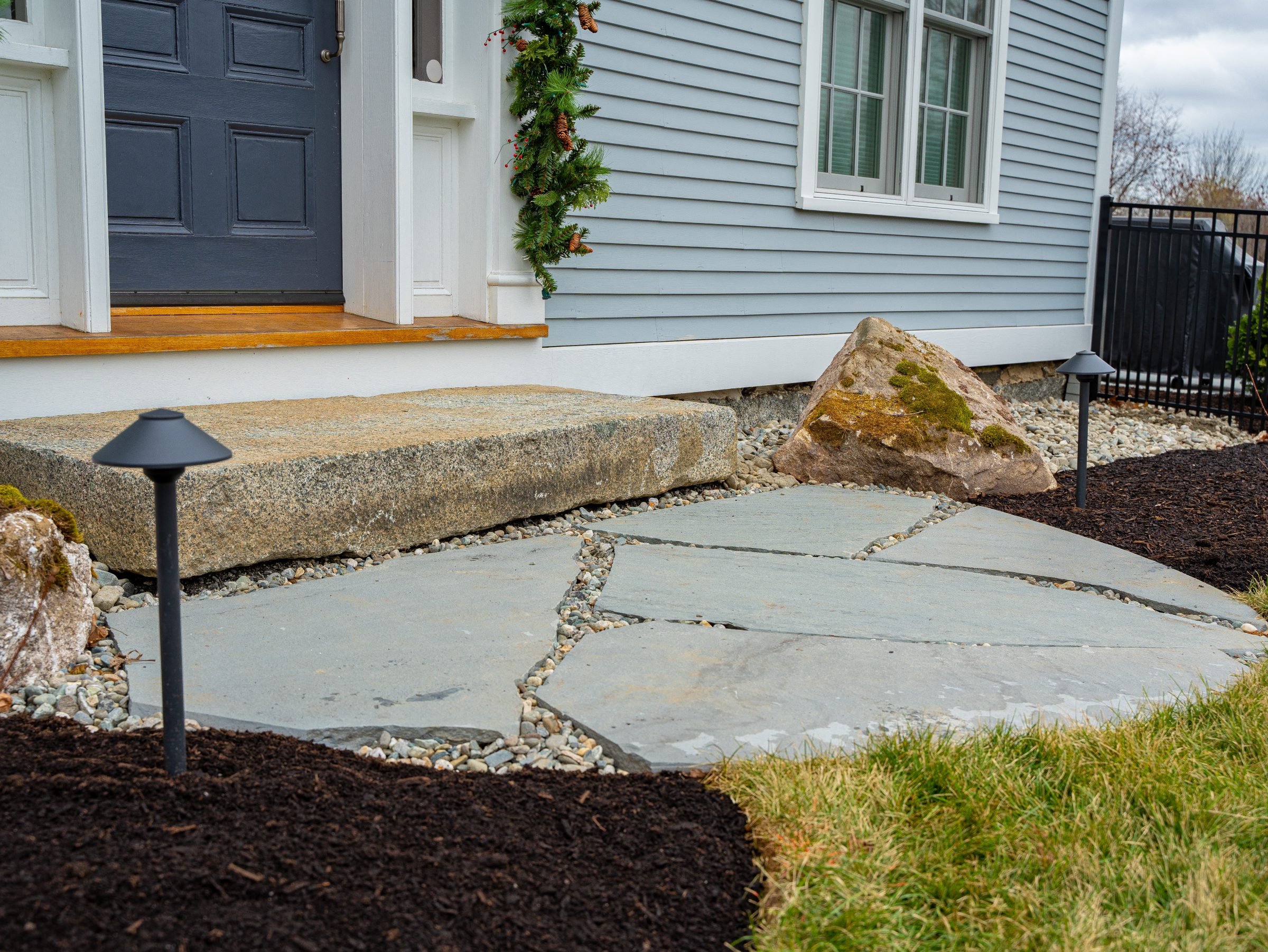 Stone walkway leading to home front entrance