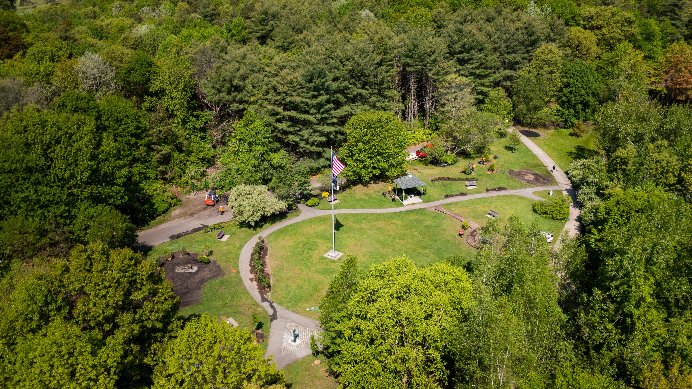 Aerial view of park with American flag