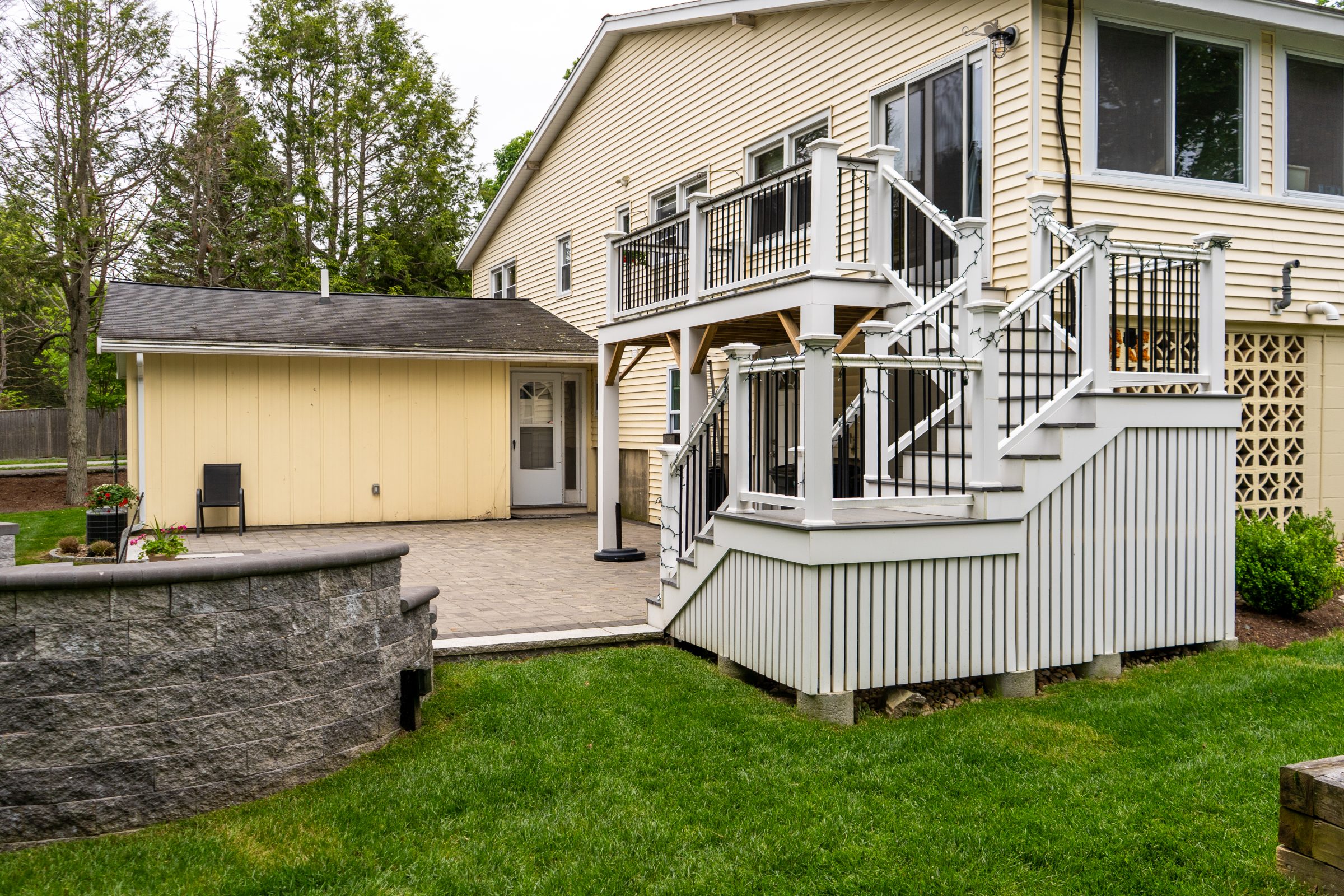 Backyard deck with stairs and patio area