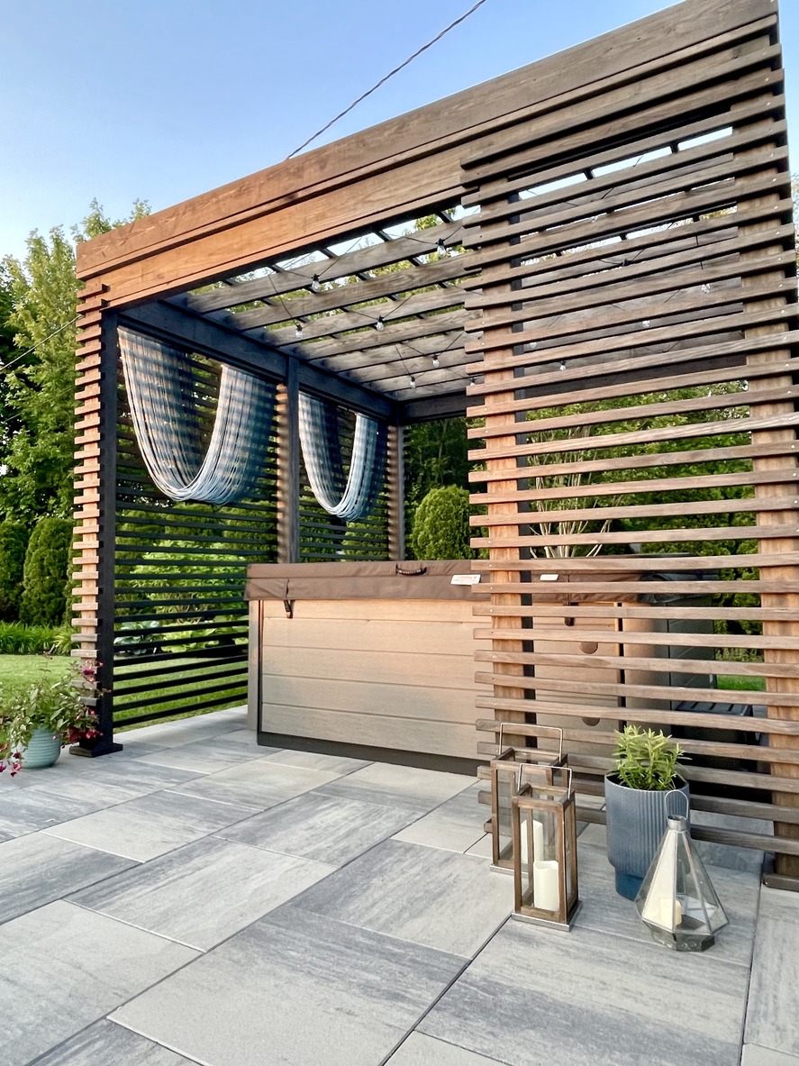 Modern wooden pergola with hot tub patio